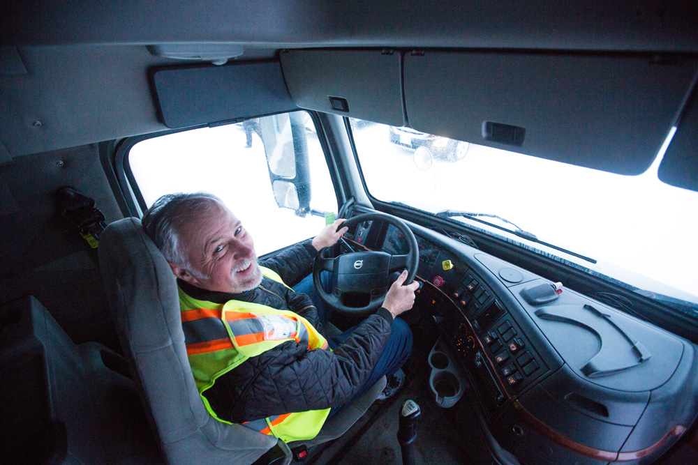 First Class Training Centre Inc. instructor Calvin Davy sits in the driver's seat of a cab at their location in Cornwallis on Wednesday. (Chelsea Kemp/The Brandon Sun)