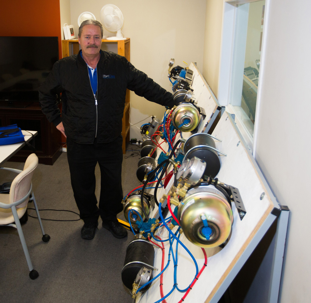 First Class Training Centre Inc. president and general manager Jim Campbell shows off the working air board in their Cornwallis classroom on Wednesday. (Chelsea Kemp/The Brandon Sun)