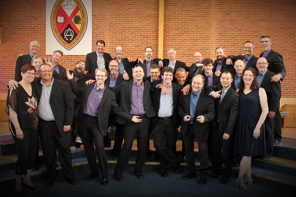 Members of Prairie Blend Men�s Choir, with founding conductor Deanna Ginn and accompanist Leanna Mitchell, pose after their 15th anniversary concert last June. (Submitted)