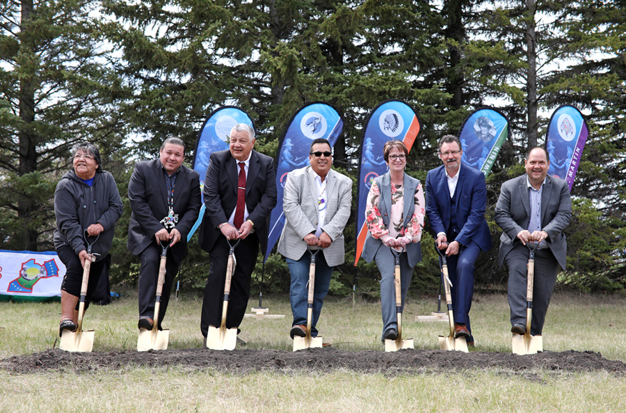 Gambler First Nation elder Marjorie Mather, Southern Chiefs Organization  Grand Chief Jerry Daniels, Gambler First Nation Chief David LeDoux, Treaty 2 Grand Chief Eugene Eastman, Indigenous and Northern Services Minister Eileen Clarke, Brandon Mayor Rick Chrest and Indigenous and Northern Affairs Canada associate regional director Terry Goertzen take part in the groundbreaking ceremony for the First Nation's urban reserve on 18th Street North in Brandon on Friday. (Tim Smith/The Brandon Sun)