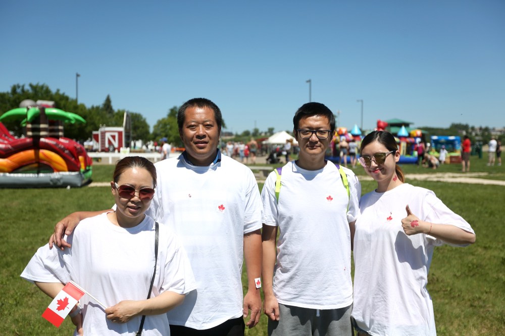Colin Slark/The Brandon Sun
Lily Ren (left) and Michael Zhang (second from left) celebrated their 10th Canada Day while Bo Wang (third from left) and Olivia Chen (right) celebrated their first at the Riverbank Discovery Centre on Monday.