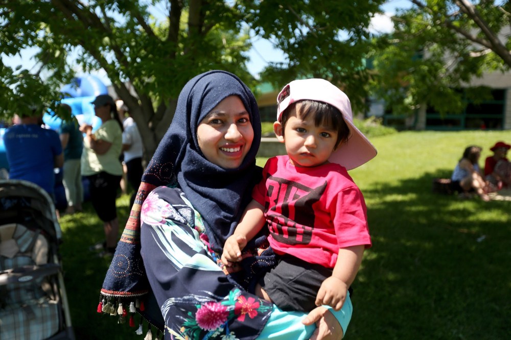 Colin Slark/The Brandon Sun
Sohana Akter holds her son at Monday's Canada Day festivities at the Riverbank Discovery Centre. She said that she hopes to be a Canadian citizen in time for next year's Canada Day.