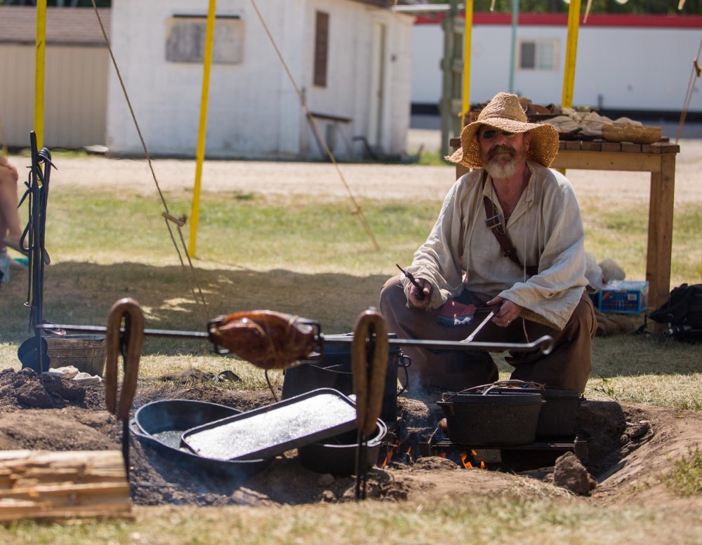 Chelsea Kemp/The Brandon Sun
Kirk Nyquist cooks a selection of meat at the Cossack Village.