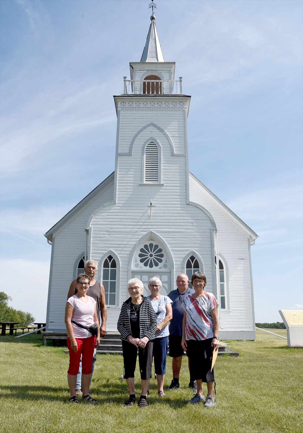 Ellen Rawlings, 99, stands front and centre with a small group of congregation members in front of Grund Frelsis Lutheran Church, the oldest-standing Icelandic church in Canada. (Bud Robertson/The Brandon Sun)