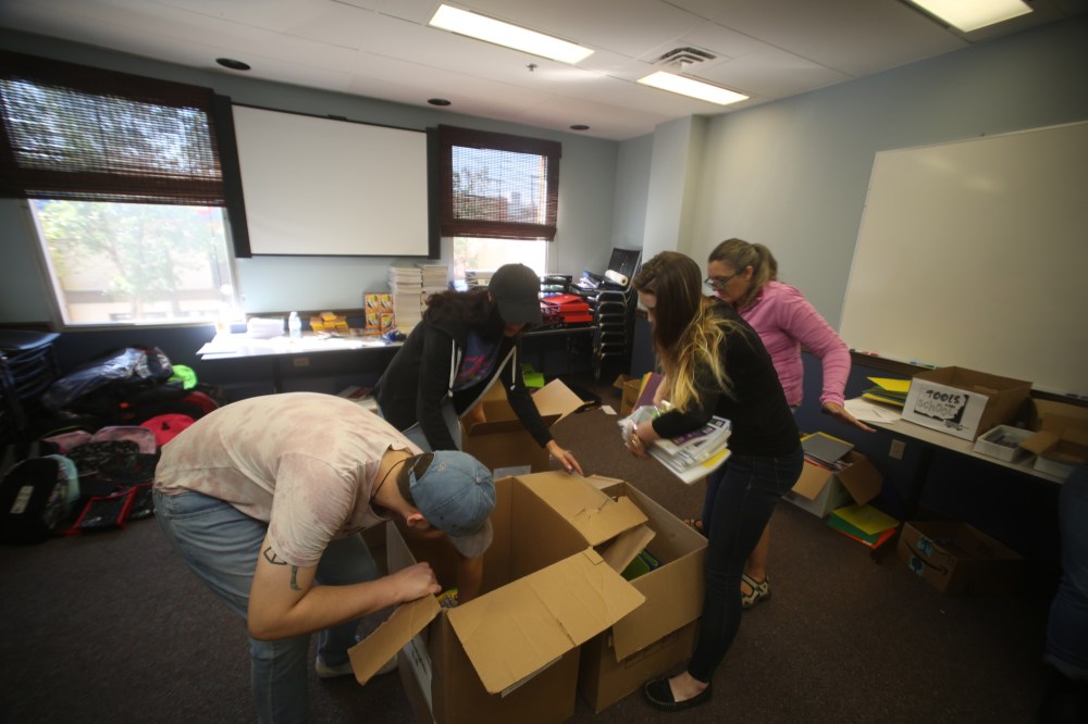 Colin Slark/The Brandon Sun
Volunteers with United Way of Brandon & District pack up school supplies on Thursday morning for the annual Tools for School campaign.