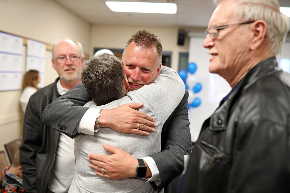 Isleifson hugs a supporter as he enters the local Progressive Conservative celebration at the Riverbank Discovery Centre on Tuesday. (Tim Smith/The Brandon Sun)
