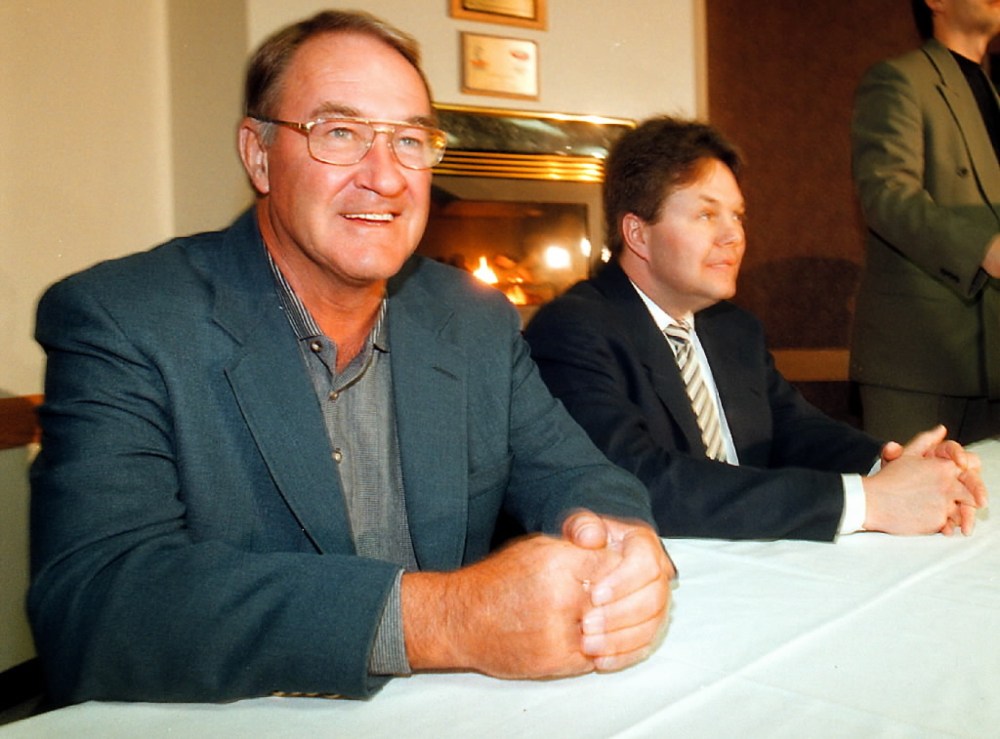 File
Cornell sits at a table with Kelly McCrimmon, who he eventually sold the team to in 2001.