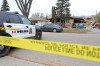 Police tape surrounds a home on the 200 block of Queens Avenue East on Wednesday. (Tim Smith/The Brandon Sun)