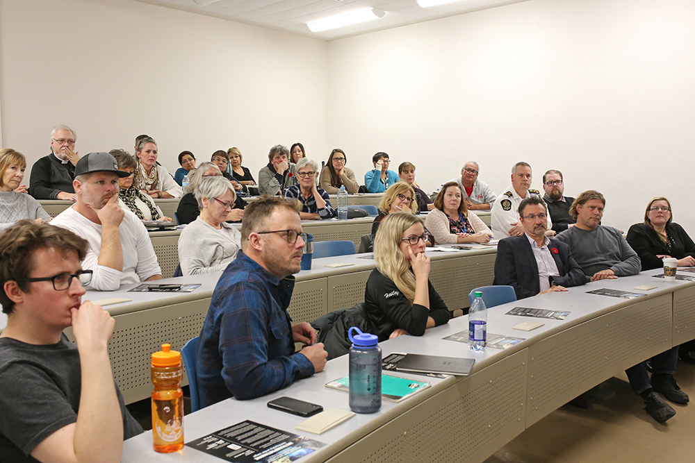 30102019
Guests listen to Rodney Bodner speak about his documentary Methamphetamine: Community Under Siege after a screening at Brandon University on Friday hosted by Kim Longstreet.  (Tim Smith/The Brandon Sun)