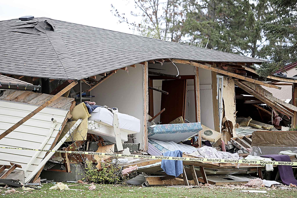 Police tape surrounds a home in the 200 block of Queens Avenue East earlier this year as the investigation continued into an explosion at the home that killed a woman and sent a man to hospital. The man was subsequently charged in relation to the incident. (Tim Smith/The Brandon Sun)