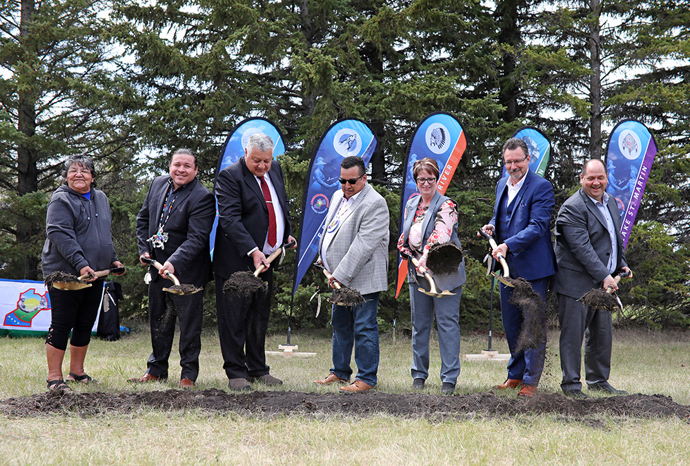 Marjorie Mather, an Elder from Gambler River first Nation, Jerry Daniels, Grand Chief of the Southern Chiefs Organization, David LeDoux, Chief of Gambler First Nation, Treaty 2 Grand Chief Eugene Eastman, Eileen Clarke, Minister of Indigenous and Northern Services with the Province of Manitoba, Brandon Mayor Rick Chrest, and Terry Goertzen, Associate Regional Director General for Indigenous and Northern Affairs Canada take part in the groundbreaking ceremony for the first nation's urban reserve on 18th Street North. (File)