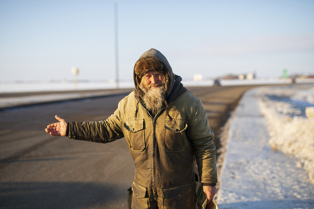 Haralson smiles while hitchhiking home on Highway 10 just north of the Trans-Canada Highway in March of 2018. (Tim Smith/The Brandon Sun)