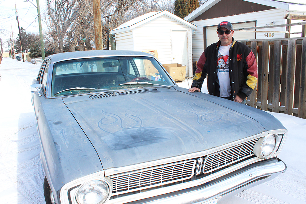 Brandon resident Mike Fontaine stands next to his 1968 Ford Falcon outside his home last week. Fontaine told the Sun on Wednesday that he’s going to use his new free time during the coronavirus outbreak to work on his classic vehicle and other ongoing automotive projects. (File)
