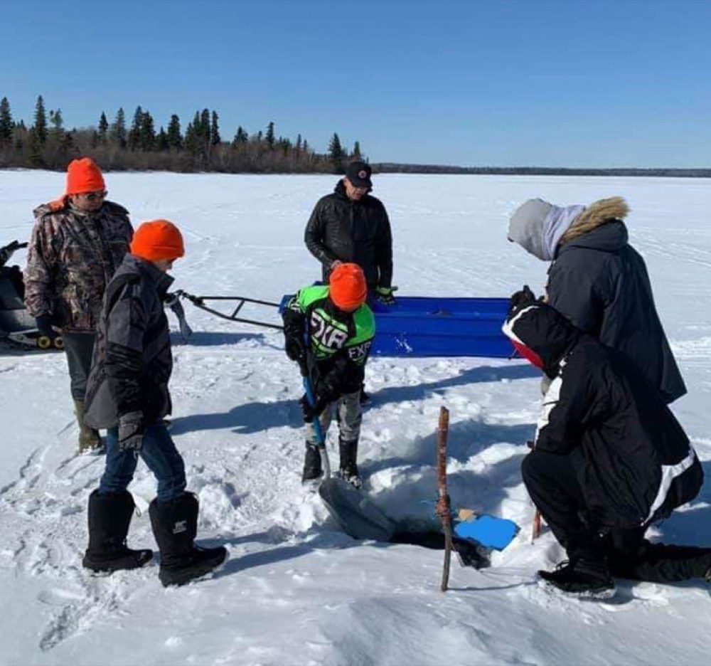 Photo courtesy Ryan Catcheway
Family members Bryan Bone, Tuscan Bone, Theron Bone, Timm Bone, Keegan Bone and Rave Bone fish for pickerel at Clear Lake late last week. The fish is to share with elders and others who can't go fishing at Keeseekoowenin Ojibway First Nation.