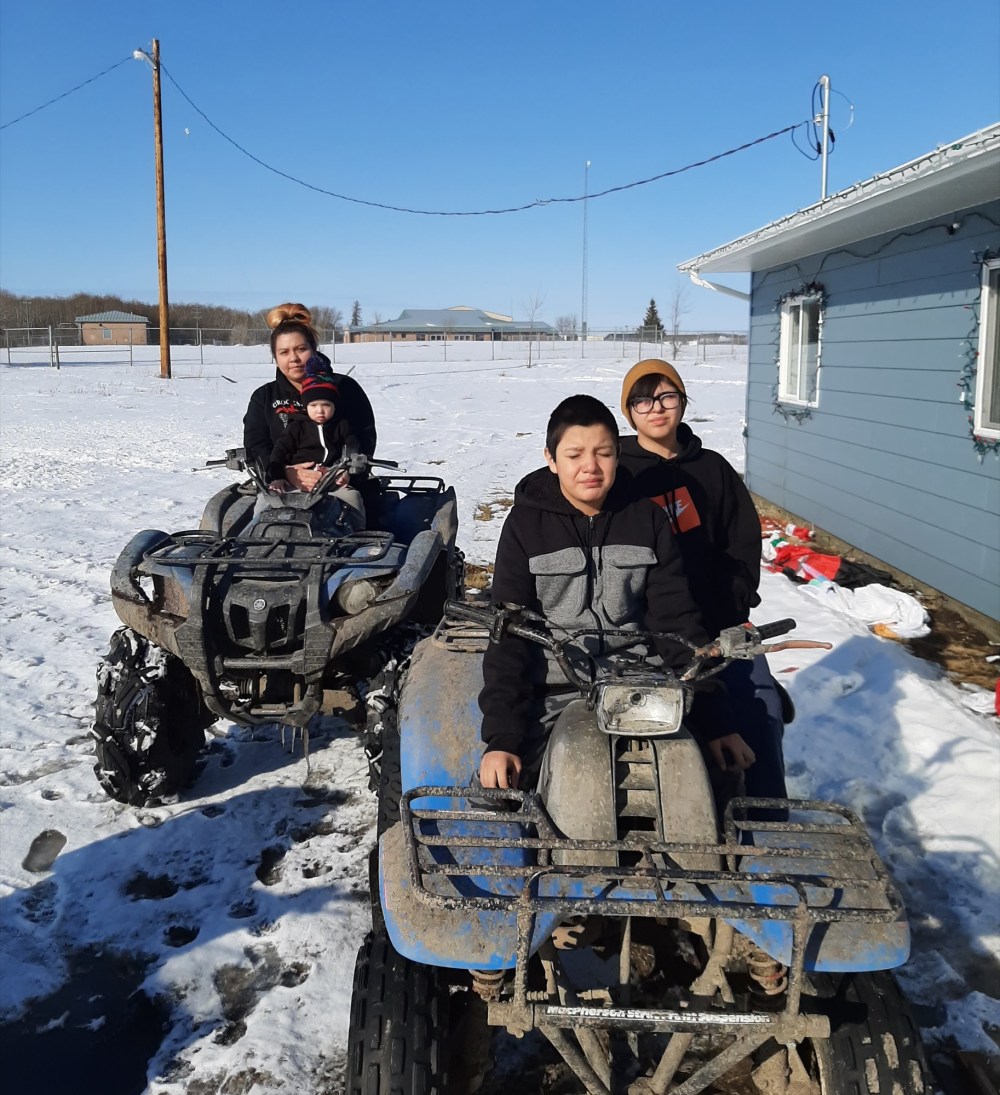 Photo courtesy Ryan Catcheway
Mindy Blackbird, with one-year-old DeRyan Catcheway, left, Ryan Jr. Catcheway and Alyssa Catcheway enjoy family time with dad Ryan Catcheway (not pictured) on a sunny spring afternoon during these times of physical distancing from others at Keeseekoowenin Ojibway First Nation last week.