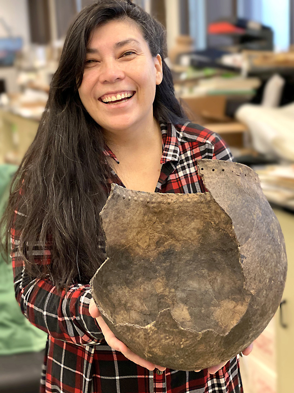 Artist KC Adams is seen with one of her pieces. A solo exhibition of her work is being hosted by The Art Gallery of Southewestern Manitoba. (Submitted)