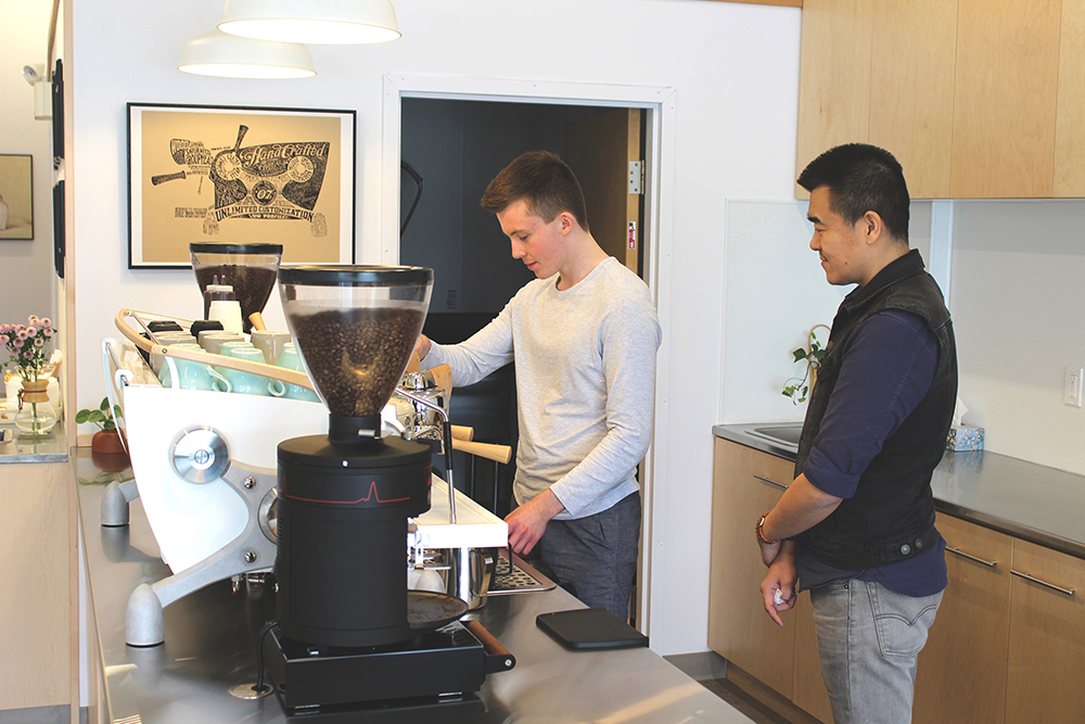 H Coffee co-owner Robin Gao, right, takes recently hired cashier Carthy Caswell through some basic training this past Friday, three days before the shop was set to open to the public. (Kyle Darbyson/The Brandon Sun)