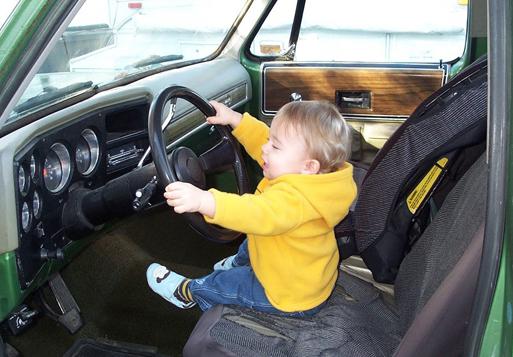 Keith Bogue's grandson Trevor gets behind the wheel of his 1974 Chevrolet Cheyenne back in the fall of 2005. (Submitted)