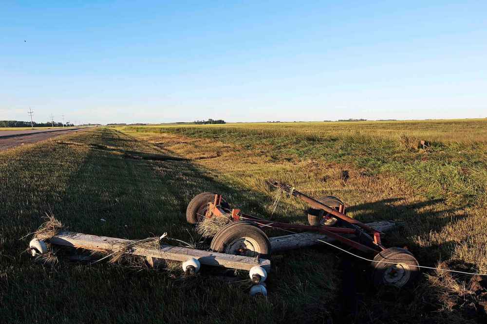 Debris is scattered through the ditch and field west of Highway 83 near Scarth, Man. on Saturday. after a powerful tornado tore through the area Friday evening. (Tim Smith/The Brandon Sun)
