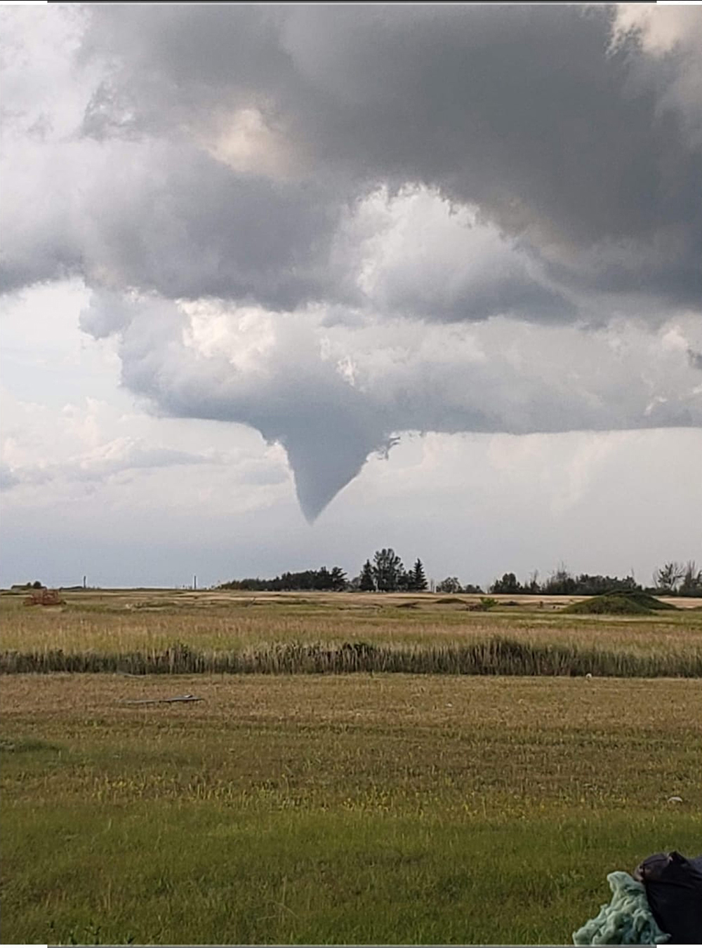 A tornado is seen touching down near Canupawakpa Dakota First Nation on Friday evening. (Photo submitted by Sharmaine Brown)