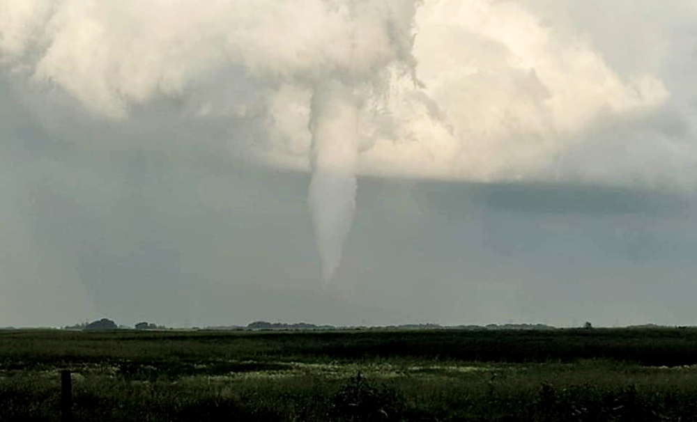 A tornado is seen touching down southwest of Virden on Friday evening. (Submitted)