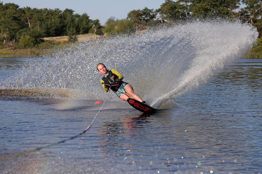 Cassandra Lepp kicks up a wave of spray while slalom water skiing on Lake Wahtopanah on Tuesday morning. Lepp learned how to waterski as a teenager and trains yearly in Florida with family under the coaching of two-time world champion Thomas Degasperi. (Tim Smith/The Brandon Sun)