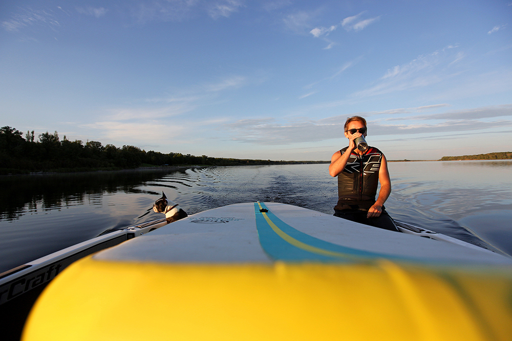 Morning light illuminates Casey Mommer as he heads out to waterski on Lake Wahtopanah on Tuesday morning. (Tim Smith/The Brandon Sun)