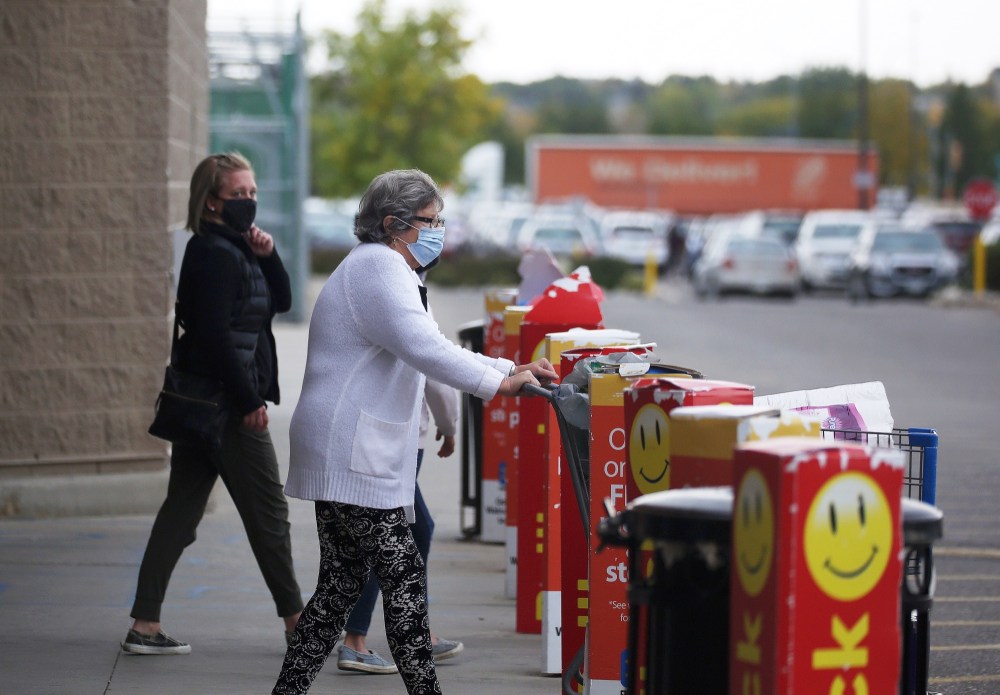 Shoppers wearing masks file in and out of Walmart in Brandon’s Corral Centre last month. They will have to do so a little longer than expected, as code red restrictions are poised to continue into January.  (Tyler Clarke/The Brandon Sun)