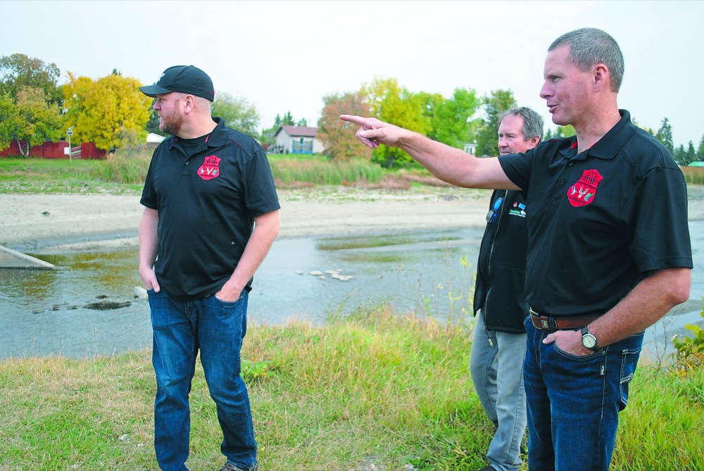 Tyler Clarke/The Brandon Sun
Rapid City and District Wildlife Association members Robert Marshall, Bob Christie and Gary Philips inspect the washed-out dam in Rapid City.