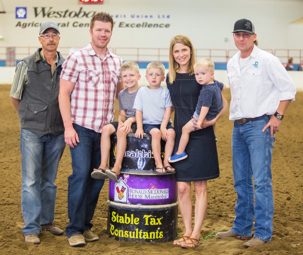 Chelsea Kemp/The Brandon Sun
The Spruyt family helps open the Northern Lights Futurity & Derby Ronald McDonald Charity race night on Friday. The Spruyts’ youngest son Henry was born premature and rushed to the children’s hospital as a baby. The family spent time at the Ronald McDonald House and now help raise funds for the charity by attending events to raise awareness. Julie Spruyt, aunt to the family, rode in the charity event.