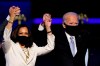Vice President-elect Kamala Harris holds hands with President-elect Joe Biden and her husband Doug Emhoff as they celebrate, in Wilmington, Del.,&nbsp;Saturday, Nov. 7, 2020. Federal cabinet ministers are welcoming Joe Biden election as the next U.S. president as an opportunity to advance the fight against climate change. THE CANADIAN PRESS/AP-Andrew Harnik