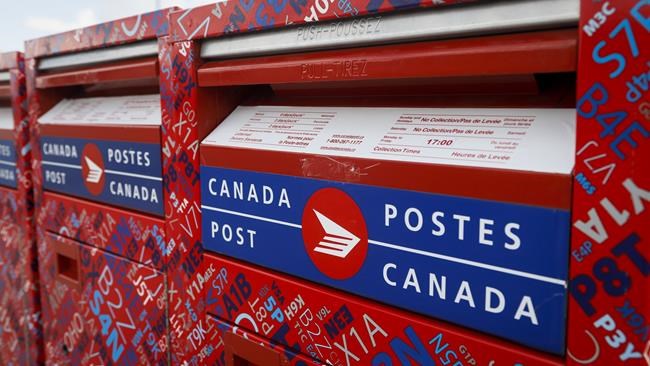 Mailboxes are seen at Canada Post's main plant in Calgary, Alta., Saturday, May 9, 2020, amid a worldwide COVID-19 pandemic. Canada Post has moved up parcel delivery deadlines within Canada in response to unprecedented holiday demand during COVID-19 but is still telling Canadians to expect delays. THE CANADIAN PRESS/Jeff McIntosh