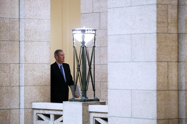 Manitoba premier Brian Pallister makes his way to question period at the Manitoba Legislature in Winnipeg, Wednesday, May 13, 2020. THE CANADIAN PRESS/John Woods