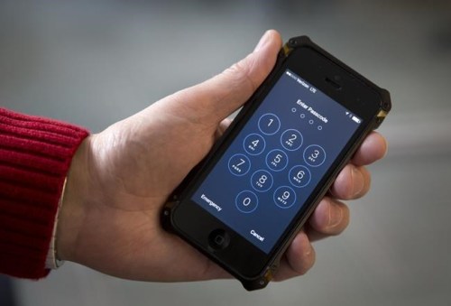 FILE - In this Feb. 17, 2016, file photo an iPhone is seen in Washington. At a time of widespread digital insecurity it turns out that the oldest and simplest computer fix there is — turning a device off then back on again — can thwart hackers from stealing information from smartphones. (AP Photo/Carolyn Kaster, File)