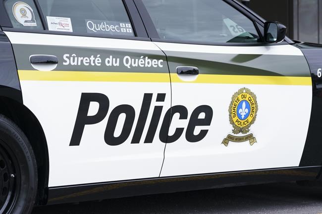 A Sûreté du Québec police car is seen in Montreal on Wednesday, July 22, 2020. An Amber Alert for a missing three-year-old Quebec boy remains in effect for a third day, as provincial police continue a ground search northeast of Quebec City. THE CANADIAN PRESS/Paul Chiasson