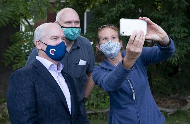 Conservative leader Erin O'Toole takes a photo with supporters during a campaign stop on Tuesday, September 14, 2021 in Russell, Ontario. THE CANADIAN PRESS/Adrian Wyld