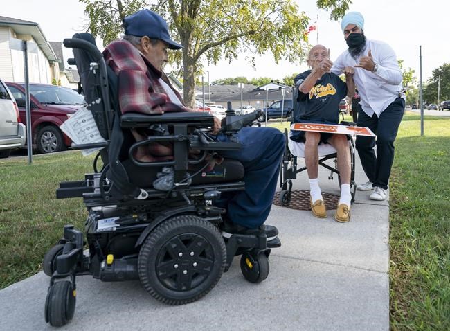 NDP leader Jagmeet Singh greets supporters following his morning announcement in Essex, Ontario on Wednesday, September 15, 2021. THE CANADIAN PRESS/Jonathan Hayward