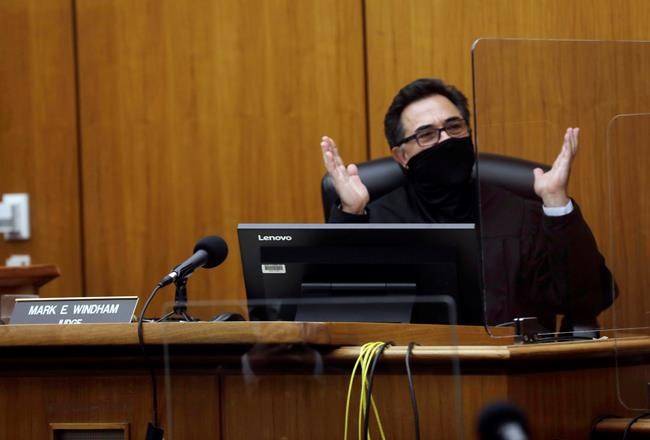 Los Angeles Superior Court Judge Mark E. Windham thanks the jury for their service after they found New York real estate heir Robert Durst guilty of murder Friday, Sept. 17, 2021 in Inglewood, Calif. A Los Angeles jury convicted Robert Durst on Friday of murdering his best friend 20 years ago, a case that took on new life after the New York real estate heir participated in a documentary that connected him to the slaying that was linked to his wife’s 1982 disappearance. (Genaro Molina/Los Angeles Times via AP, Pool)