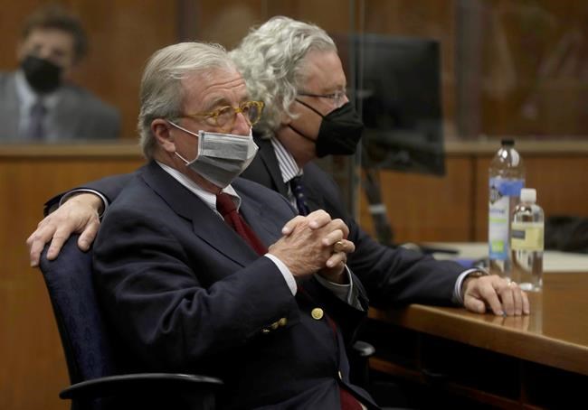 Robert Durst attorney's Dick Deguerin, left, and David Chesnoff listen to the verdict being read by Los Angeles Superior Court Judge Mark E. Windham in court Friday, Sept. 17, 2021 in Inglewood, Calif. A Los Angeles jury convicted Robert Durst on Friday of murdering his best friend 20 years ago, a case that took on new life after the New York real estate heir participated in a documentary that connected him to the slaying that was linked to his wife’s 1982 disappearance. (Genaro Molina/Los Angeles Times via AP, Pool)