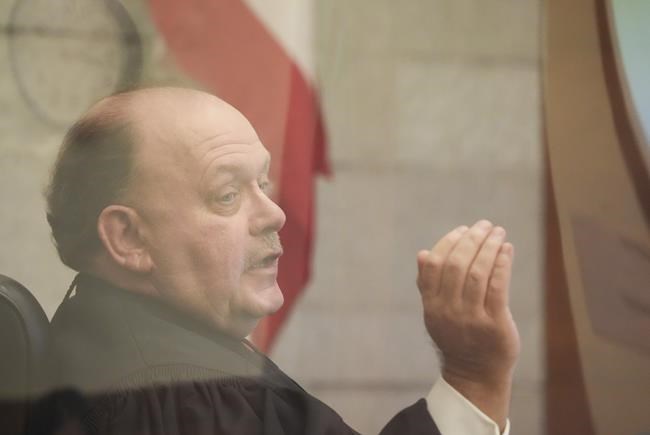 Franklin County Common Pleas Court Judge Michael Holbrook speaks during a motion to dismiss hearing in State of Ohio vs. William Husel on Wednesday, Dec. 1, 2021 at the Franklin County Common Pleas Courthouse in Columbus, Ohio. Holbrook is weighing arguments about whether to dismiss the 25-count murder case against Husel. (Joshua A. Bickel/The Columbus Dispatch via AP)