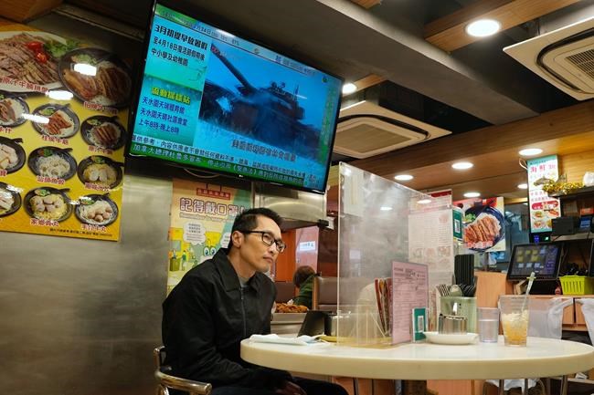 A TV screen broadcasts the news of Russian troops that have launched their attack on Ukraine, at a restaurant in Hong Kong Thursday, Feb. 24, 2022. Russian troops launched their anticipated attack on Ukraine on Thursday, as President Vladimir Putin cast aside international condemnation and sanctions, warning other countries that any attempt to interfere would lead to