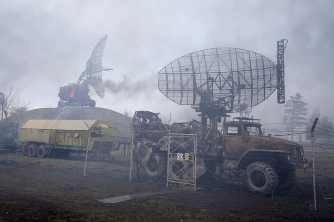 Damaged radar arrays and other equipment is seen at Ukrainian military facility outside Mariupol, Ukraine, Thursday, Feb. 24, 2022. Russia has launched a barrage of air and missile strikes on Ukraine early Thursday and Ukrainian officials said that Russian troops have rolled into the country from the north, east and south. (AP Photo/Sergei Grits)