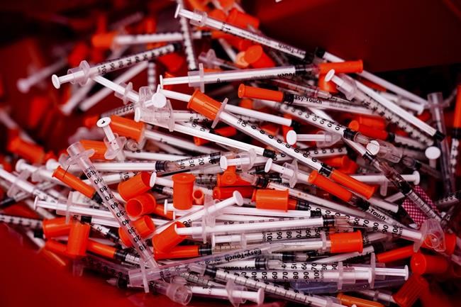 Shown are used syringes collected at a needle exchange run by Camden Area Health Education Center in Camden, N.J., Thursday, Feb. 24, 2022. Four companies involved in the opioid industry are finalizing settlements over the addiction crisis in the U.S. in deals that could total $26 billion over 18 years. (AP Photo/Matt Rourke)