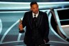 Will Smith cries as he accepts the award for best performance by an actor in a leading role for 