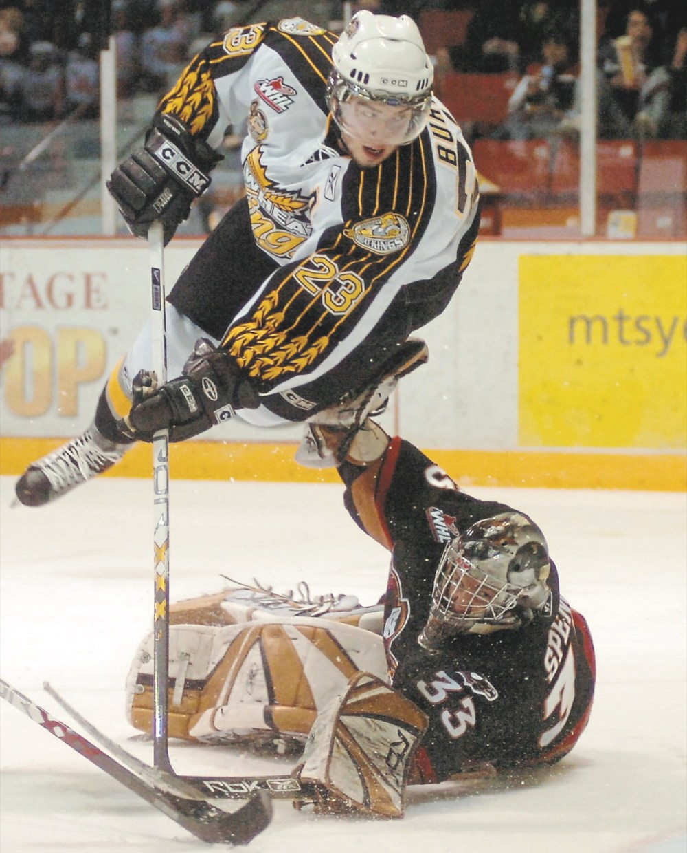 Brandon Sun file photo
Brandon Wheat Kings forward Cody Burki flies over Calgary Hitmen goaltender Dan Spence to score during Game 5 of their Eastern Conference semifinal at Westoba Place on April 13, 2007. Calgary won the series in six games.