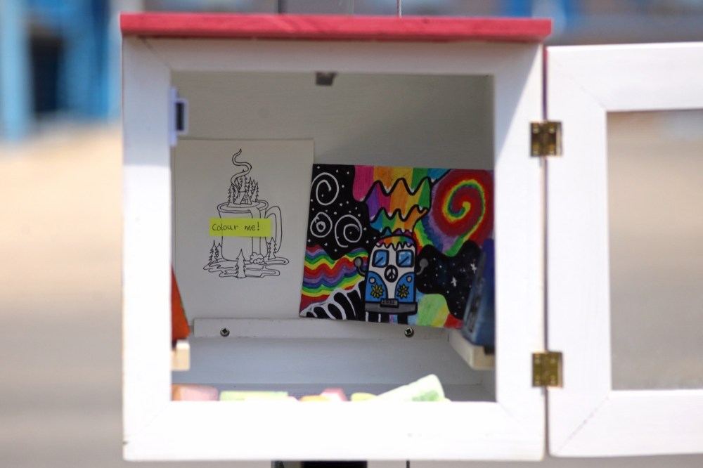 Art and sidewalk chalk is seen at the free little art gallery the Witherspoons created on Braecrest Drive.