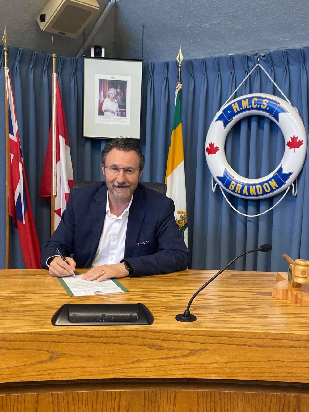 Submitted
Mayor Rick Chrest signs a proclamation for June 5, recognizing the HMCS Brandon and its crew’s “dedication and sacrifice in the service to our nation.”