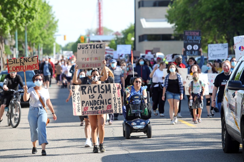 File
Marchers make their way along Ninth Street to a gathering at Princess Park organized by Brandonites Engaged Against Repression (BEAR) last year.