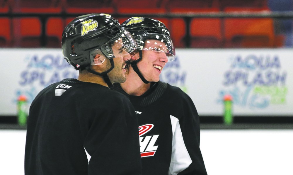 Perry Bergson/The Brandon Sun
Overage defencemen Neithan Salame and Chad Nychuk share a laugh as they wait their turn to begin a drill at Brandon Wheat Kings practice on Monday at Westoba Place. With just eight veterans on the ice, the older players are expected to show the way to the rookies.