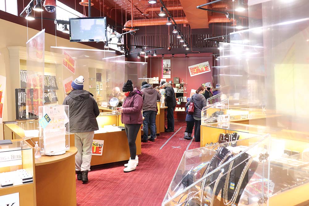 Kyle Darbyson/The Brandon Sun
Customers browse the merchandise on display at Zeke's Jewellers Saturday afternoon, looking to find a good deal at the store's retirement sale.